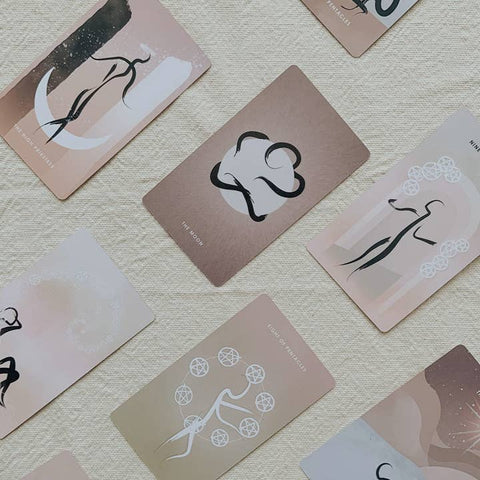 Set of tarot cards with abstract designs on a textured surface
