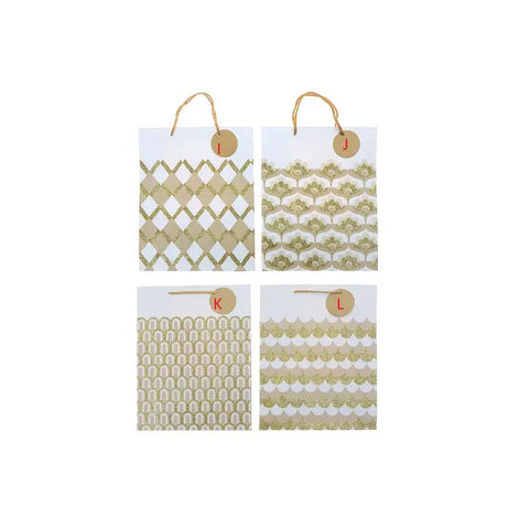 Four small bags with gold and white patterns on a white background