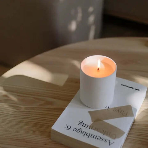 Laconic Collection: Bonhomie Candle on table