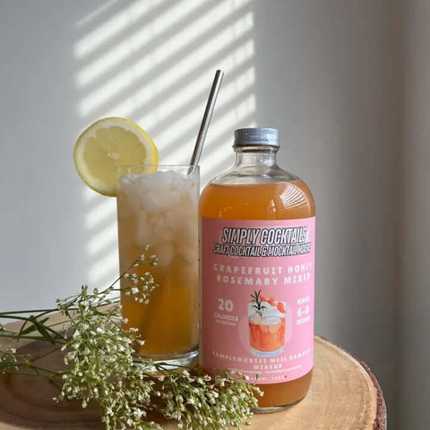 Grapefruit Rosemary Cocktail Mix in large glass bottle