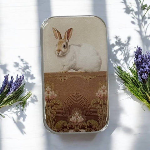 Phone case with a rabbit design on a white background with lavender and greenery