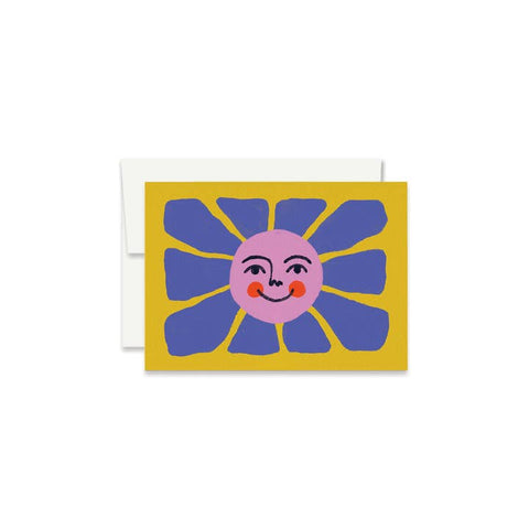 Greeting card with a blue flower design on a yellow background
