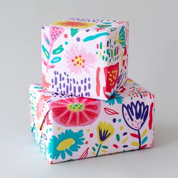 Colorful floral-patterned boxes on a light gray background