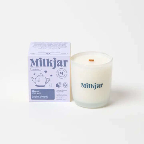 Milkjar candle and packaging on a white background