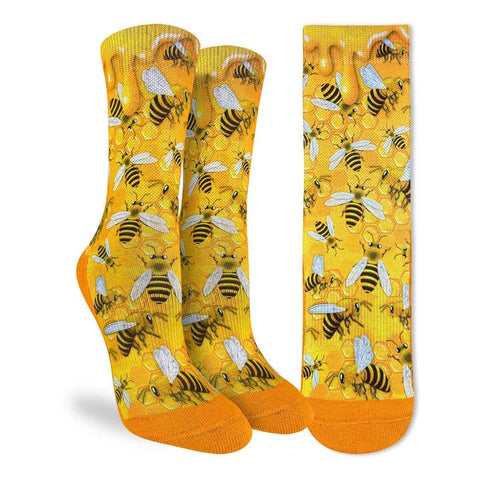 Yellow socks with bee pattern on a white background