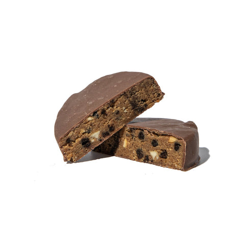 Chocolate-covered cookie with visible chocolate chips on a white background