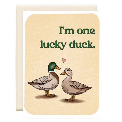 Card with two ducks and text 'I'm one lucky duck' on a beige background