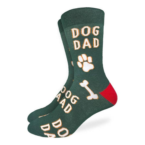 Green socks with 'DOG DAD' text and paw print design on a white background