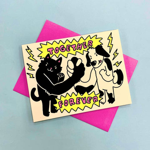 Greeting card with a black cat and dog illustration and 'Together Forever' text on a pink envelope.