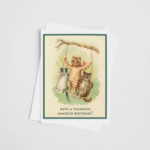 Vintage-style birthday card with cats on a swing and humorous text.