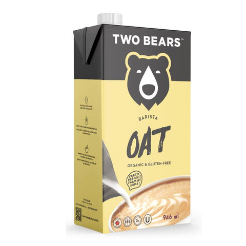 A 946 ml carton of Two Bears Barista Oat Organic & Gluten-Free milk, featuring a black and pale yellow design with a bear logo and a latte art graphic.
