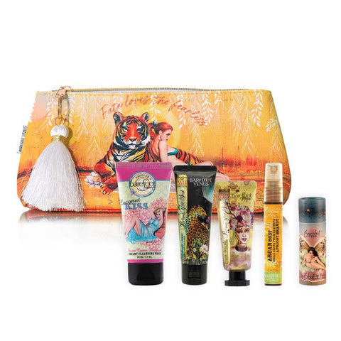 Set of beauty products including a pouch with a tiger design on a white background
