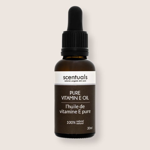 Scentuals Pure Vitamin E Oil bottle on a beige background