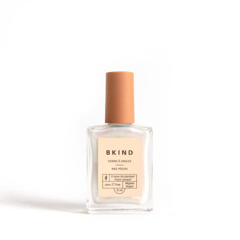 Bottle of BKIND nail polish on a white background