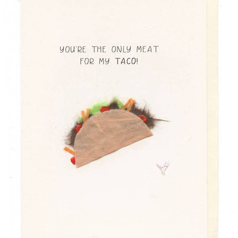 Taco-shaped pillow with text 'You're the only meat for my taco!' on a light background