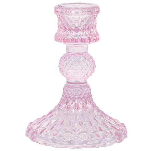 Pink glass candle holder on a white background