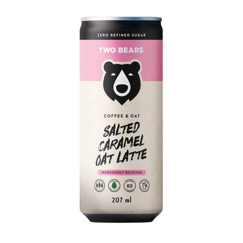 A 207 ml aluminum can of Two Bears Salted Caramel Oat Latte, featuring a cream-colored label with a pink band, a black bear logo, and product details on a white background.