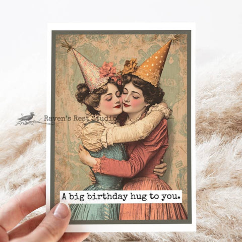Vintage-style birthday card with two women hugging, text 'A big birthday hug to you.' from Raven's Rest Studio.