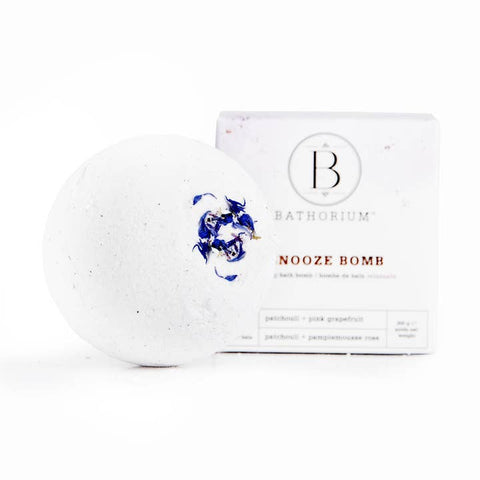 Bath bomb with packaging labeled 'Bathorium Nooze Bomb' on a white background
