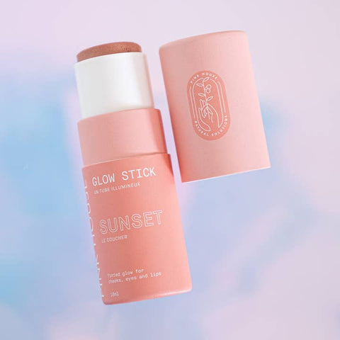 Pink glow stick with white cap on a gradient background