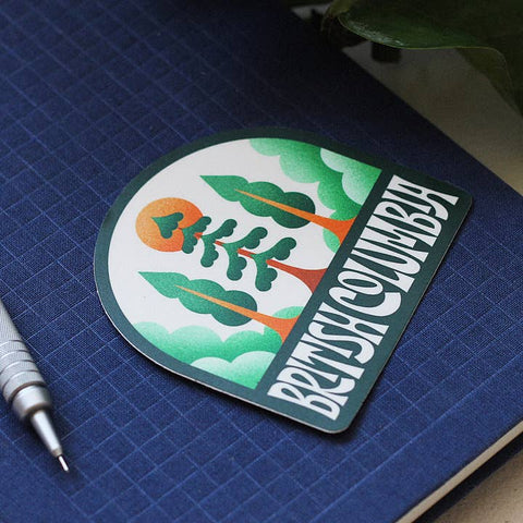 Sticker with 'British Columbia' design on a blue notebook