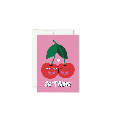 Greeting card with cherries and 'Je T'aime' text on a pink background