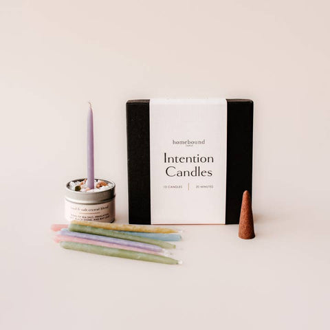 Intention candles with packaging on a light background