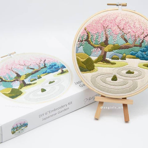 Embroidery hoop with Japanese garden design and matching box on a white background