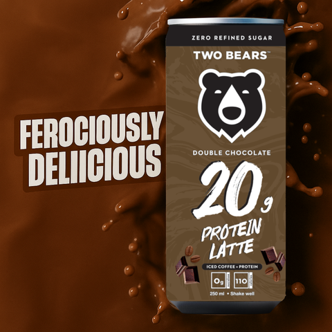 Two Bears Double Chocolate Protein Latte can with chocolate splashes on a dark background