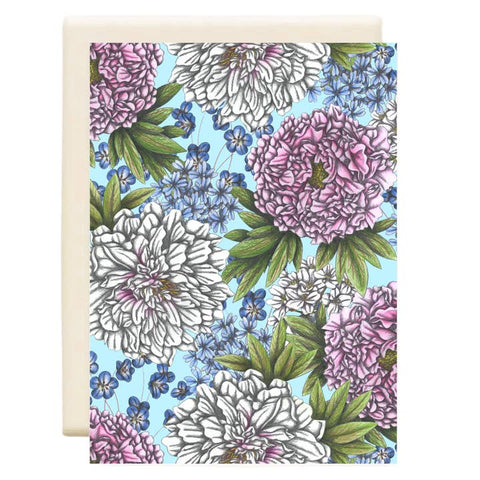 Floral patterned card with pink, white, and blue flowers on a light blue background