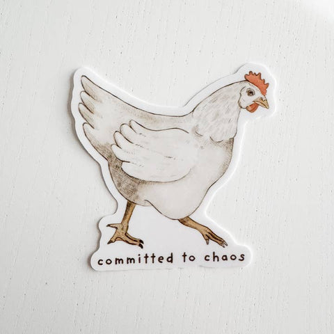 Sticker of a chicken with 'committed to chaos' text on a light background