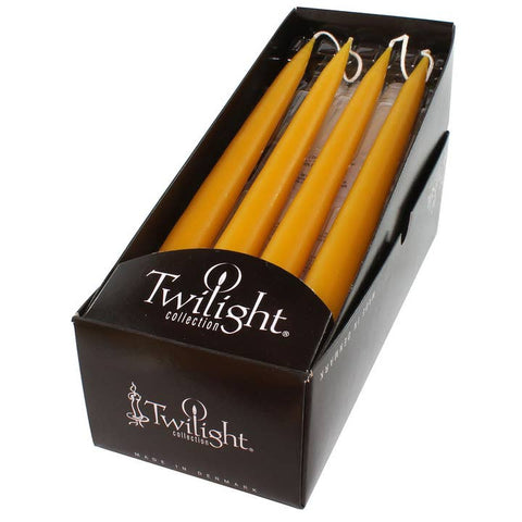 Four yellow candles in a box labeled 'Twilight collection' on a white background