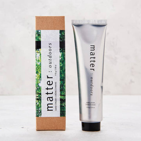 Hand cream tube and packaging with 'matter: outdoors' branding on a light background