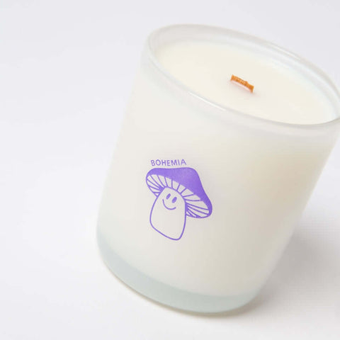 Candle with a mushroom design and 'Bohemia' text on a white background