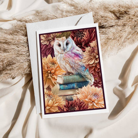 Greeting card with an owl and flowers on a textured surface
