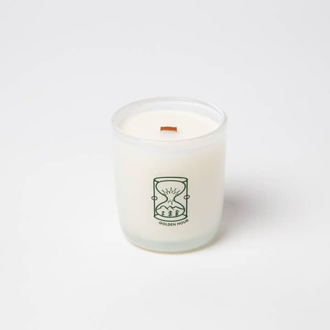 White candle with a logo on a white background