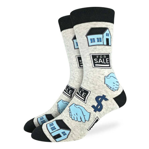 Gray socks with real estate-themed designs on a white background