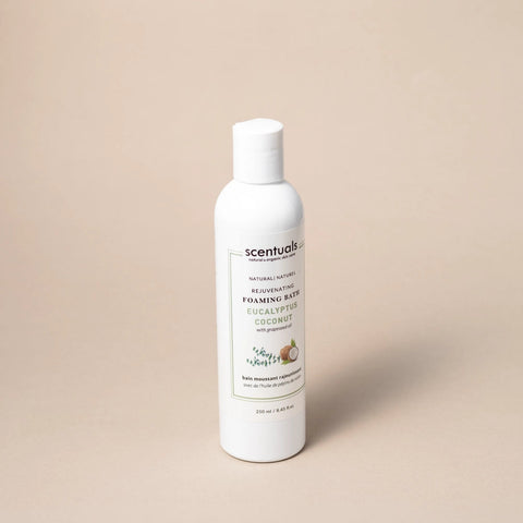 Scentuals foaming bath bottle on a beige background