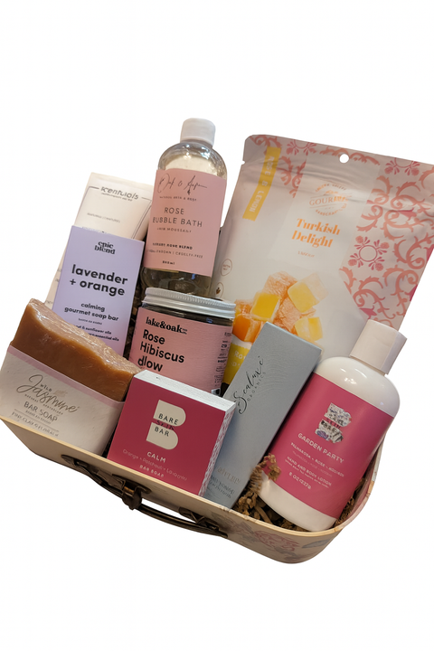 Basket of various Canadian made bath and body products on a white background