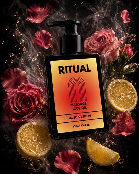 Massage body oil bottle labeled 'Ritual' with roses and lemon slices on a dark background
