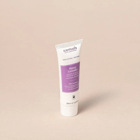 Tube of Scentuals Honey Lavender hand cream on a beige background