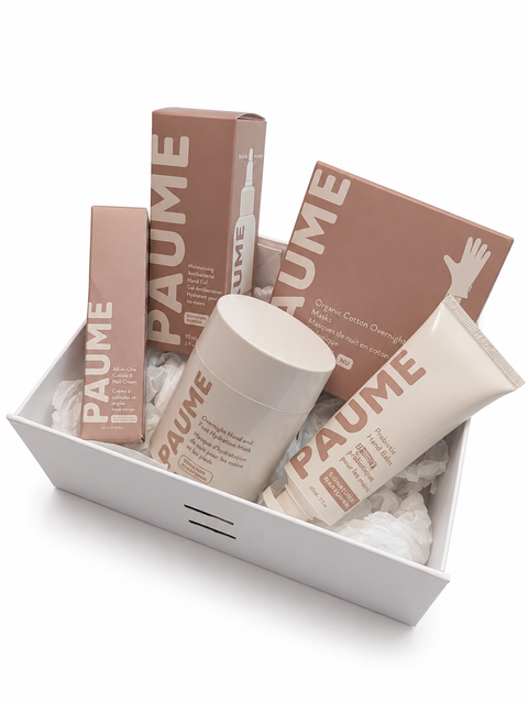 PAUME skincare products including boxes and bottles in a white tray on a white background