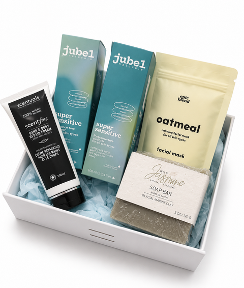 Collection of skincare products including cream, soap bar, and facial mask in a box with 'jubel' branding.