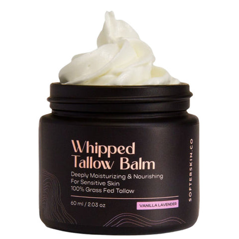 Whipped tallow balm in a black jar with visible branding on a white background
