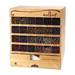 Wooden spice rack with various compartments filled with incense sticks branded 'ascent'.