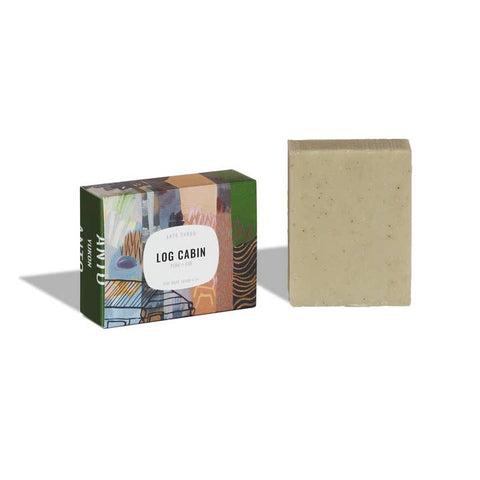 Bar of soap with a 'Log Cabin' branded box on a white background