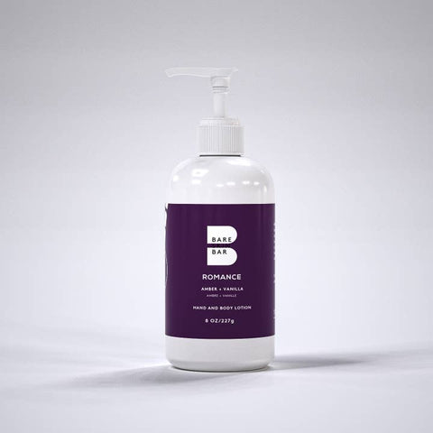 Bottle of Bare Skin Bar by Steven Romance hand and body lotion on a white background