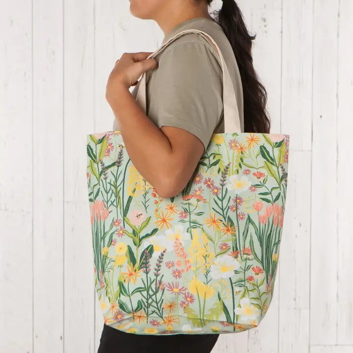 Bees & Blossoms Floral Tote Bag on shoulder