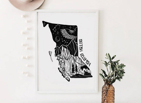 Framed black and white illustration of British Columbia on a white wall.