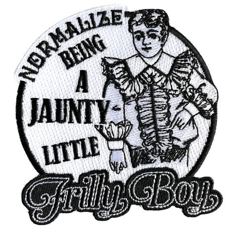 Embroidered patch with text and a stylized illustration of a person in a frilly outfit.